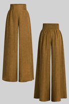Brown high waist wide leg pants with elastic waistband and lightweight fabric.