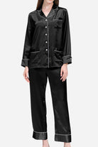 Black long sleeve silk pajamas with button-up top and matching pants