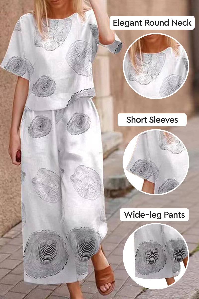 Linen and cotton loose two-piece set with floral print, short sleeves, round neck top, and wide-leg pants for breathable summer wear