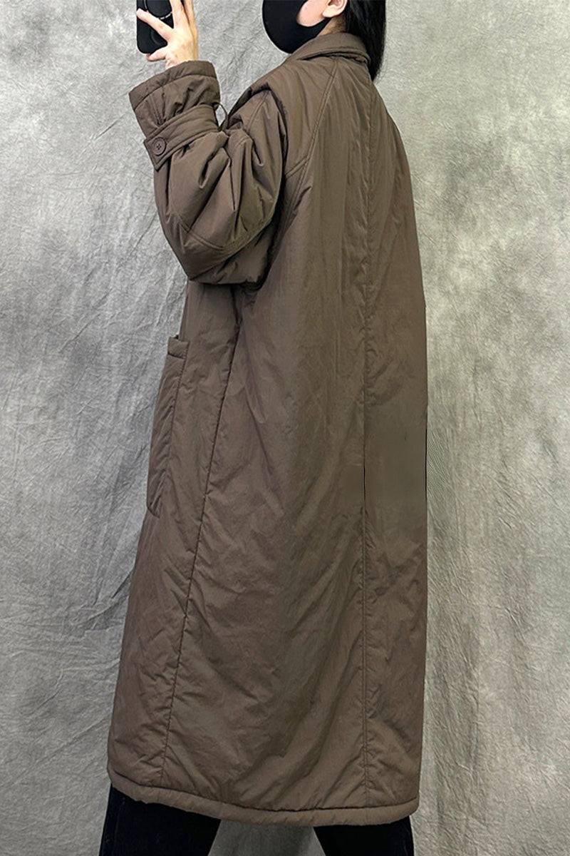 Plus size oversized brown windbreaker parka with long sleeves and relaxed fit worn by model