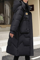 Black FrostLine Long Coat women's lightweight insulated winter travel coat with hood and button fasteners