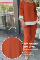 Dual-tone 3/4 sleeve two-piece set in orange with white trim, made of breathable cotton-polyester blend for comfort and style