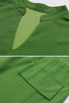 Close-up details of green All-Day Drape Dress neckline and adjustable sleeve with button tab