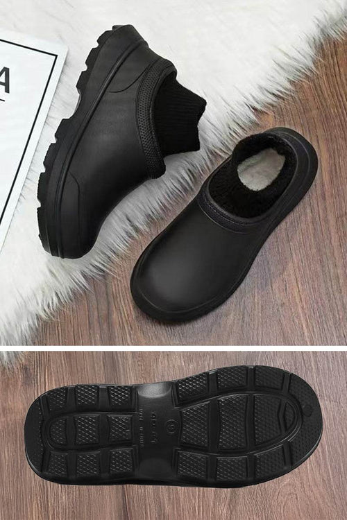 Black fleece-lined comfort clogs with waterproof exterior and textured grip sole for all-weather wear