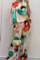 plus size vibrant floral matching set with colorful abstract flower prints on flowy top and pants