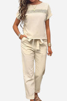 Beige 100% cotton total comfort two-piece set with short-sleeve top and drawstring pants for breathable travel wear