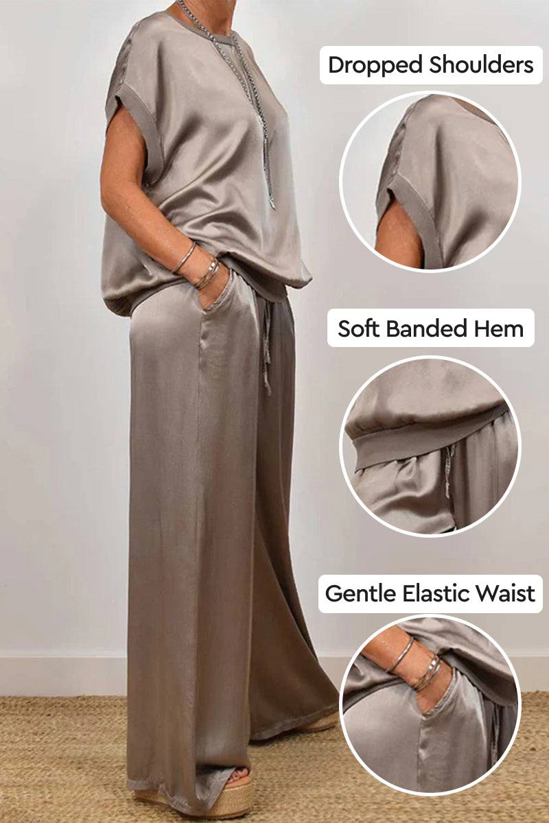 Silken Escape Satin Two-Piece Set with dropped shoulders, soft banded hem, and gentle elastic waist in elegant taupe satin fabric.