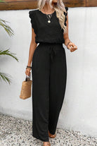 Elegant two-piece set in black with lace details, soft fabric, and a relaxed fit perfect for comfortable, stylish wear.