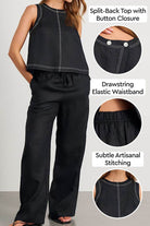 Woman wearing black cotton-linen relaxed two-piece set with split-back top, button closure, elastic drawstring waistband, and subtle artisanal stitching.