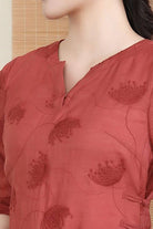 Rusty orange 100 linen dress with embroidered notch neck and 3/4 sleeves.