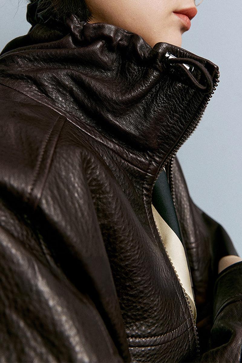 Close-up of a dark brown genuine sheepskin leather jacket collar and zipper