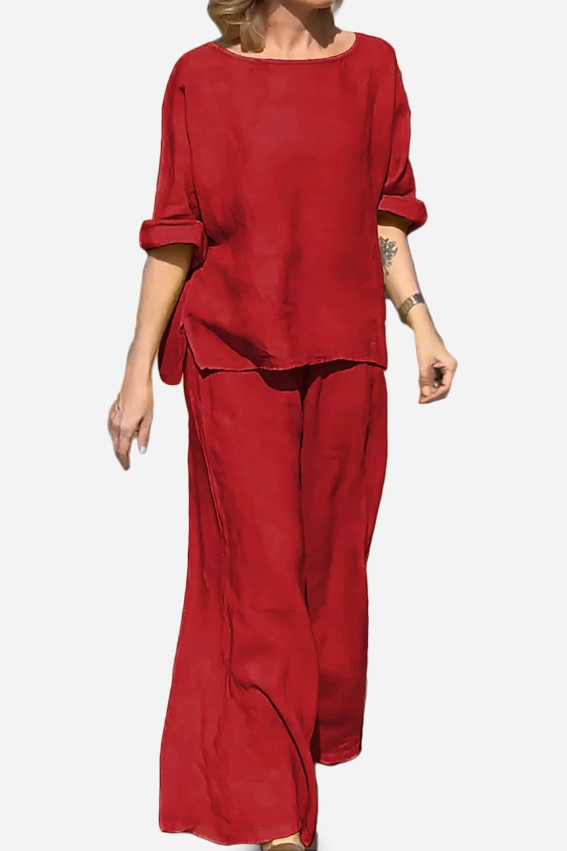 Red 100% cotton two-piece set with round neck top and wide-leg pants for comfortable, breathable wear.