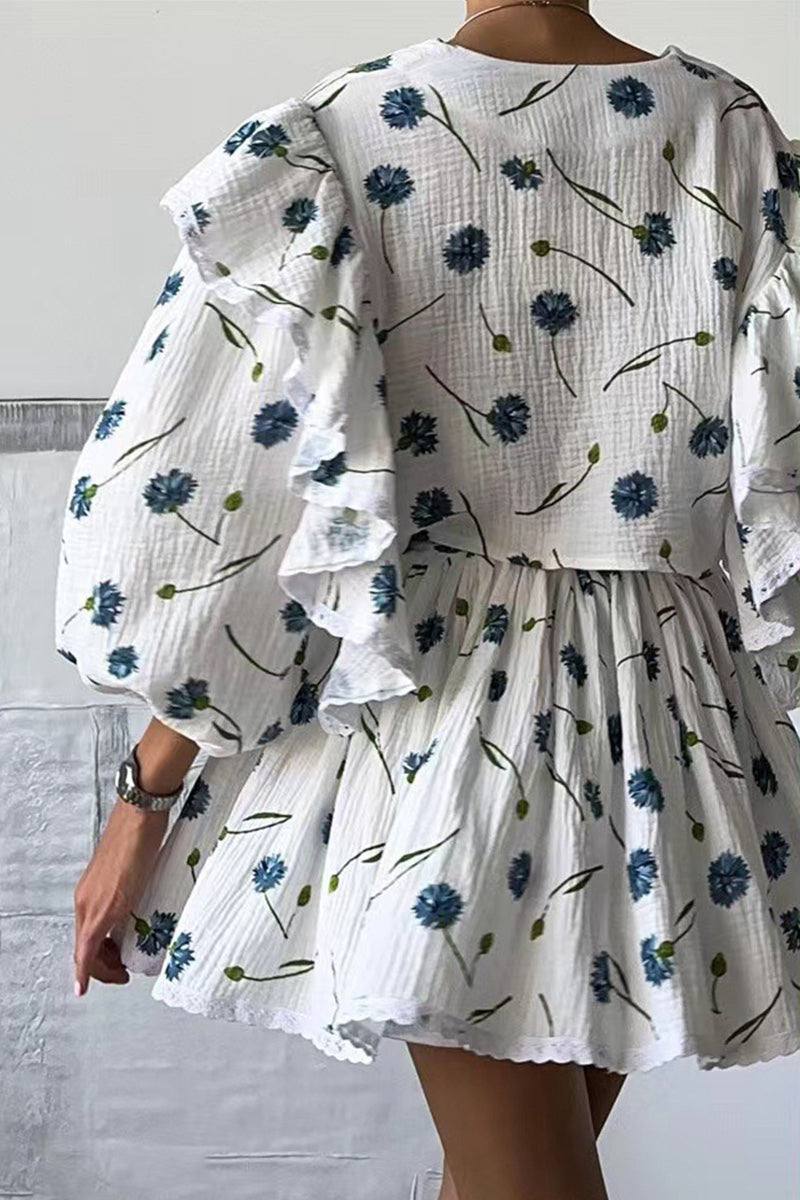Woman wearing Sweet Countryside 100 Cotton white ruffled two-piece set with blue floral print from the back