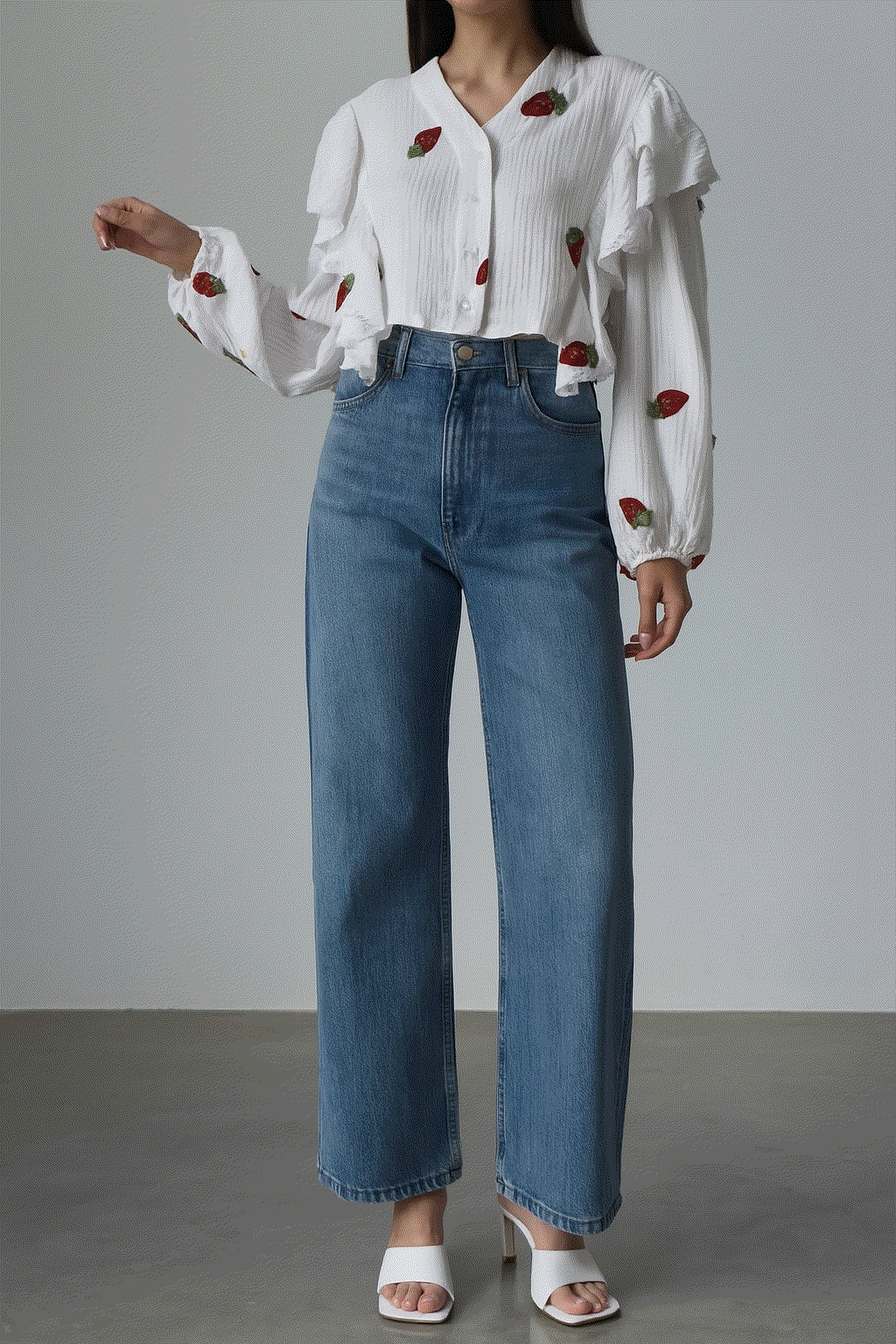 Sweet Countryside 100% cotton ruffled white blouse with strawberry prints paired with blue jeans.
