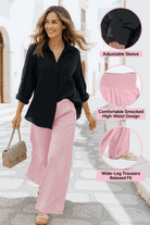 Woman wearing Oversized Linen Leaved-IN Set with black oversized linen-blend shirt and pink high-waisted wide-leg palazzo pants walking on street