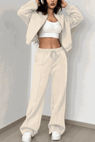 The Voyager Zip Set cream zip-front sweatshirt and wide-leg joggers travel outfit