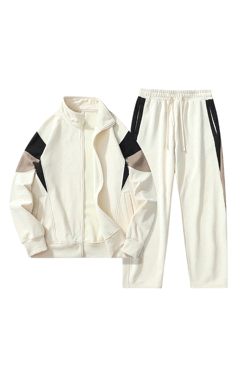 Comfort in Motion lightweight white athleisure tracksuit set with black and taupe accents for travel and active wear
