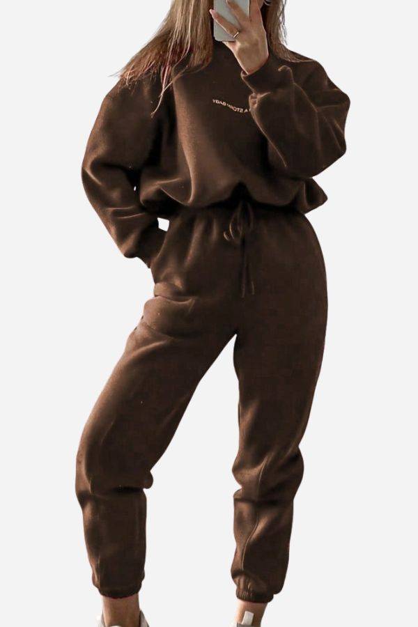 Woman wearing brown Storm Sweater Mock Neck athleisure set with relaxed fit and adjustable waist