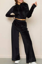 Black velour tracksuit with cropped hoodie and high-waist wide-leg pants, soft and plush fabric