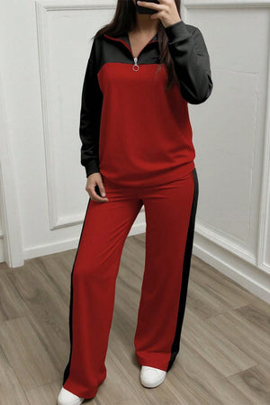 Woman wearing red and black Colorblock Comfort Leisure Set with half-zip top and wide-leg pants.