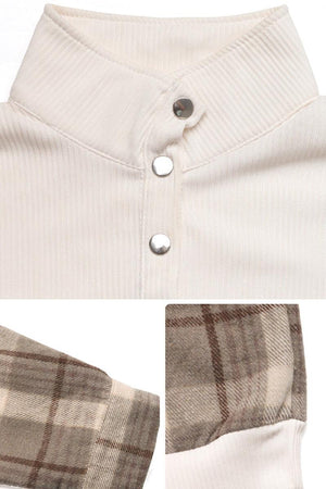 Close-up of waffle knit sweatshirt with button detail and plaid flannel sleeves in neutral tones
