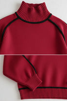 Red Zero Itch Turtleneck Sweater with black contrast trim, soft knit, and relaxed fit