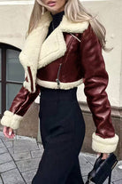 Cropped faux leather sherpa jacket with cream fleece lining and trim, zip front, and fitted waist design for stylish warmth