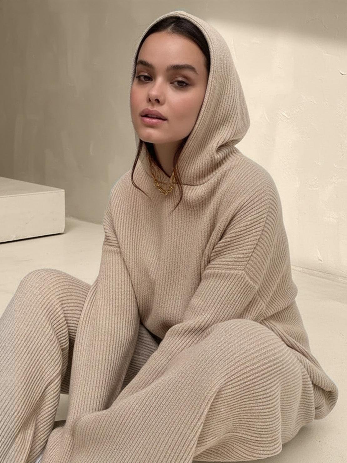 woman wearing beige waffle-knit two-piece hoodie and pants lounge set sitting indoors