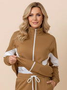 Woman wearing Colorblock Comfort Tracksuit with contrast curved panels and relaxed fit