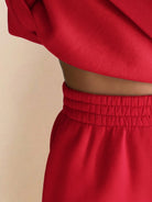 Close-up of red warm & easy two-piece set with elastic waistband and soft fabric