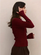 Front view of a ribbed zip-up knit cardigan jacket with high neckline and long sleeves, in a soft stretch fabric designed for a slim fit and comfortable all-day wear.