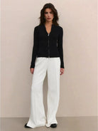 Women's zip-up knit cardigan jacket with vertical ribbing and high neckline