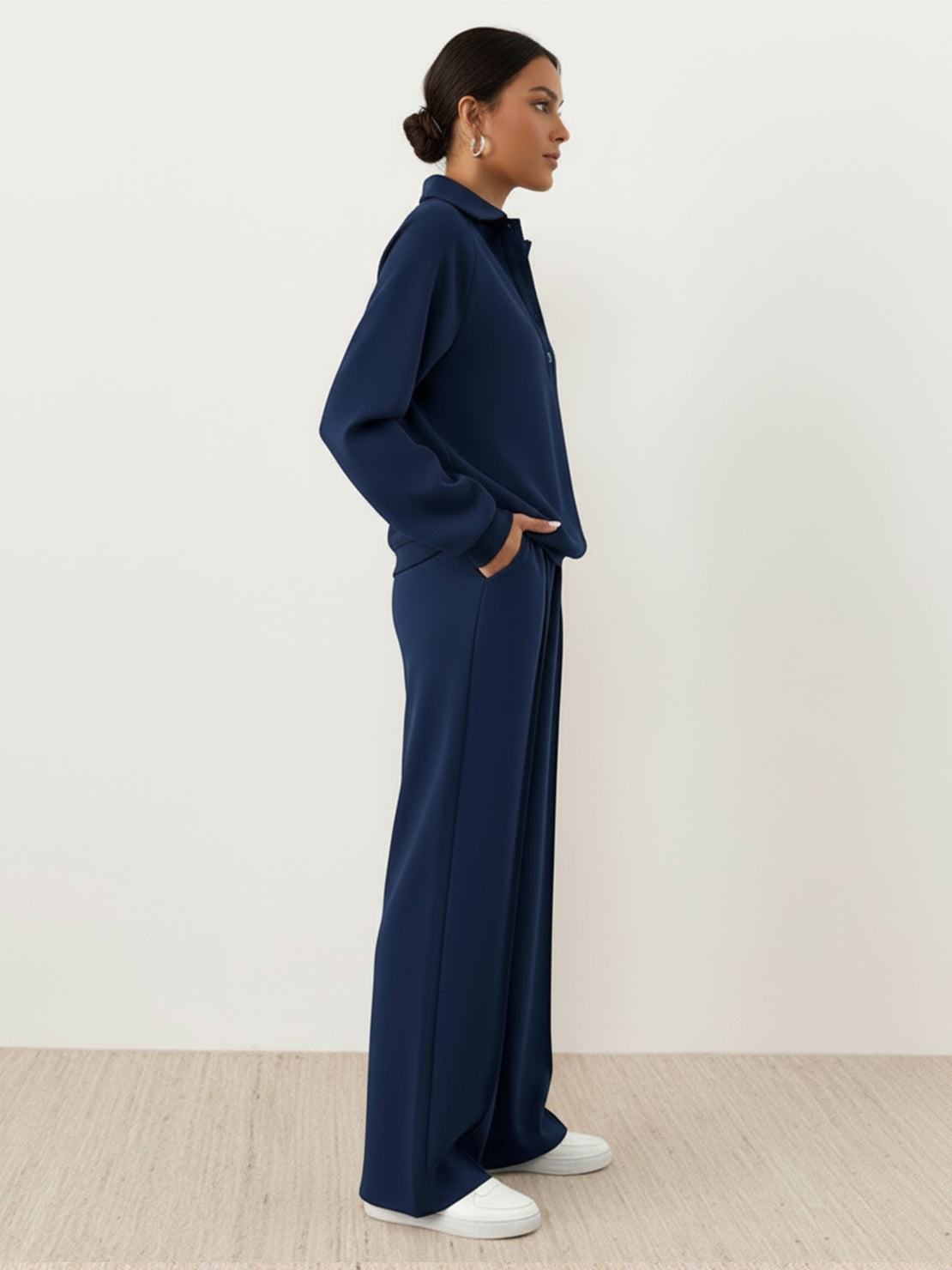 Wrinkle-free two-piece casual polo set with quarter-button top and high-waisted pants in breathable fabric