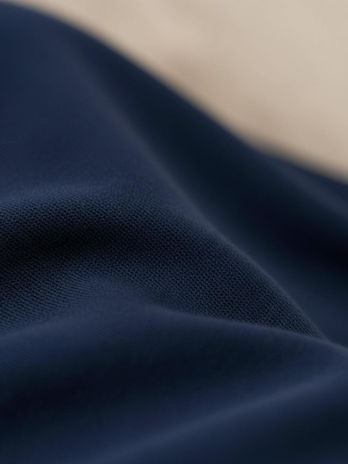 Wrinkle-free polo set with structured two-piece design, breathable fabric, and high-waisted pants