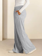 Soft knit wide-leg pants with relaxed fit and elastic drawstring waist in breathable knit fabric