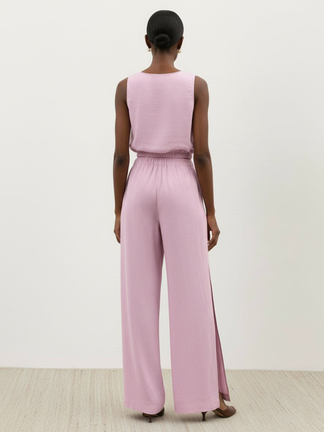 Lightweight linen-blend set with sleeveless top and wide-leg pants featuring elastic waistband and side slits for breathability
