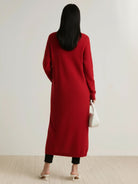 Long Australian Merino Wool cardigan with open front, patch pockets, and ribbed cuffs, ideal for layering in cooler seasons