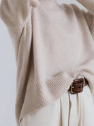Oversized crew neck knit sweater with drop-shoulder sleeves and ribbed cuffs in neutral color