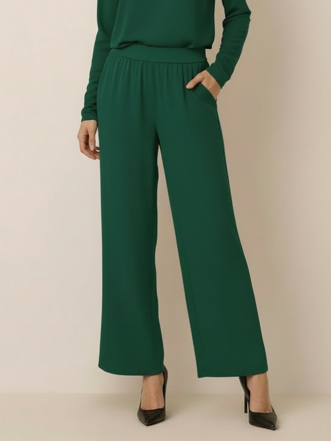 Woman wearing open-front three-piece co-ord with longline cardigan, tank top, and wide-leg trousers