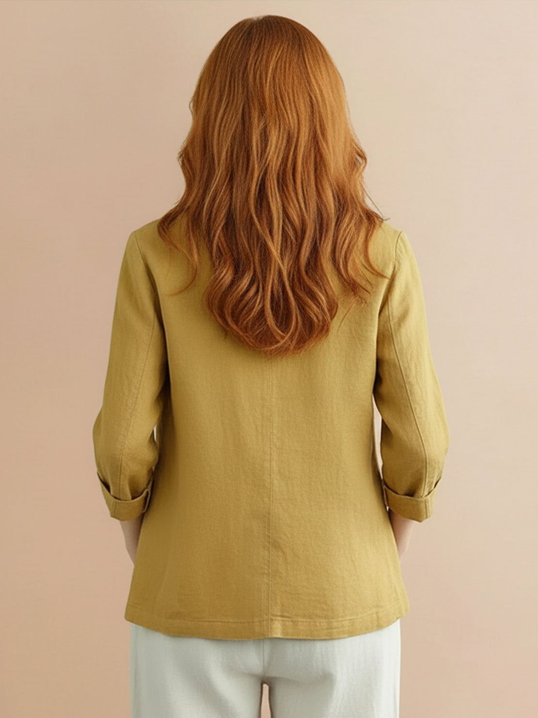 Cotton-linen blazer with relaxed fit, notch lapels, two-button closure, patch pockets, and natural textured fabric.