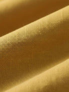 Cotton-linen blazer with relaxed fit, notch lapels, two-button front, and natural textured fabric