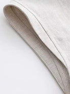 100% cotton-linen sleeveless top with round neckline and back button closure, relaxed A-line fit, hip-length design