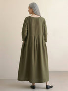 Maxi cotton-linen empire waist dress with 3/4 sleeves and deep side pockets in natural crinkle texture