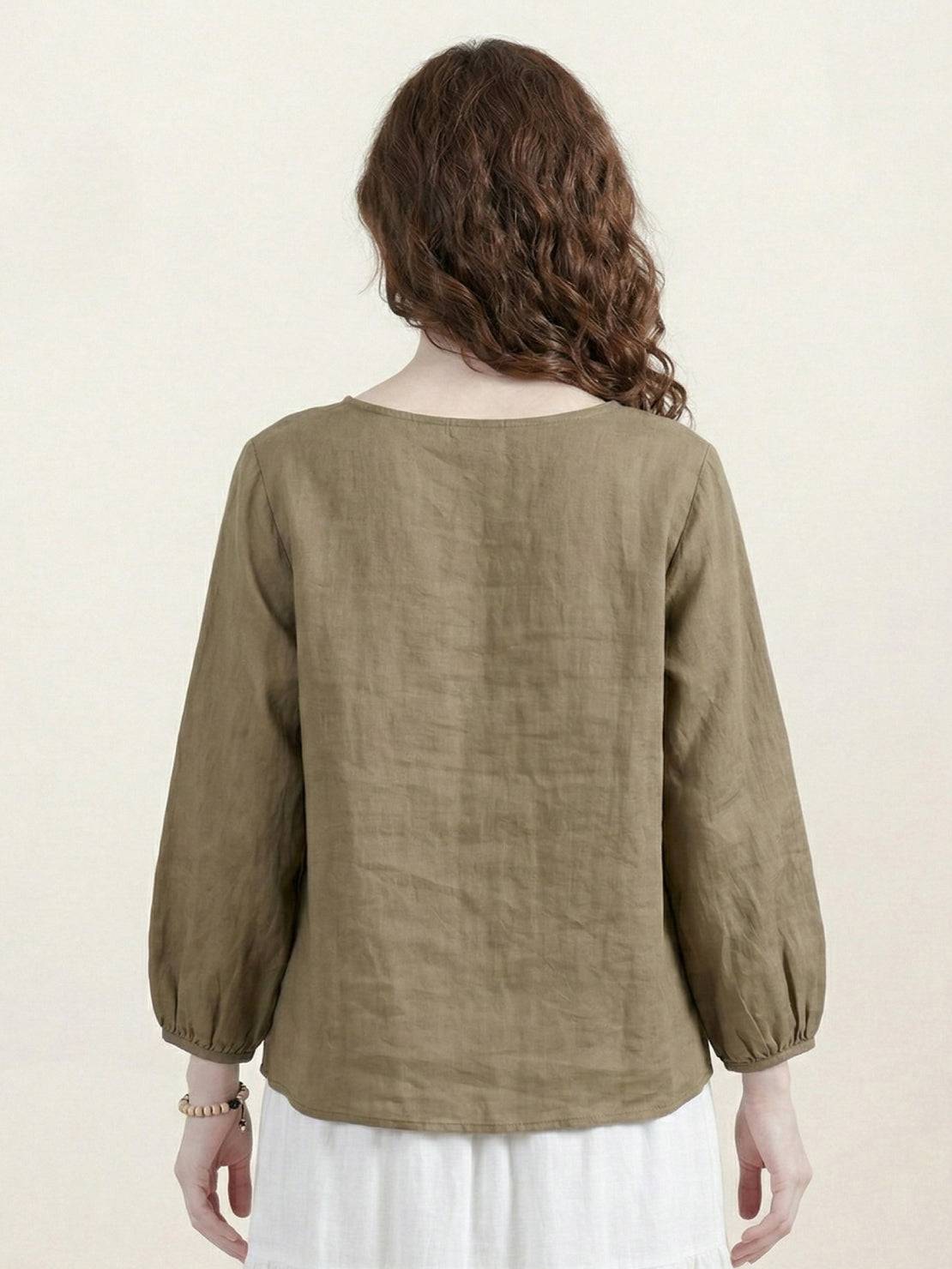 100% cotton-linen embroidered blouse with relaxed boxy fit, 3/4 balloon sleeves, and tonal floral embroidery on shoulder