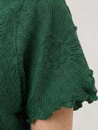 Floral Jacquard Pleated Top with 3D floral texture and flutter sleeves in relaxed A-line silhouette