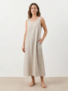White cotton linen sleeveless maxi dress with round neckline and ankle-length hem