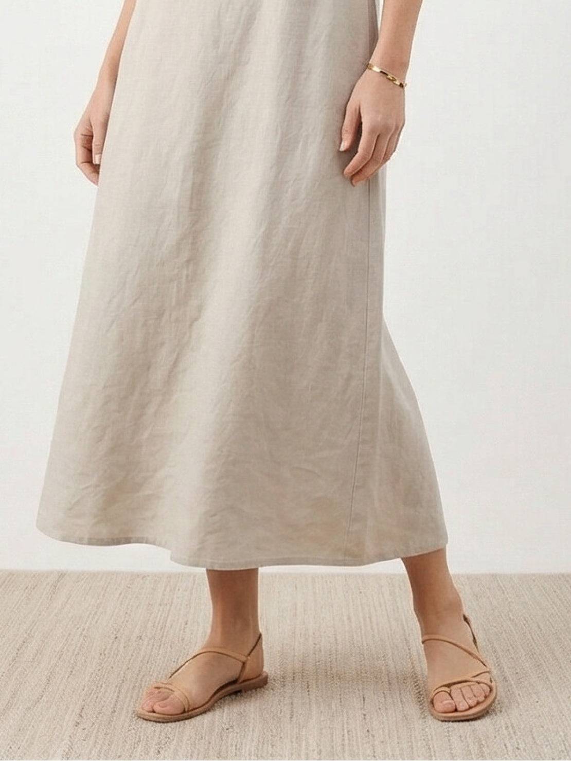 Lightweight cotton linen sleeveless maxi dress with round neckline and flowing ankle-length silhouette