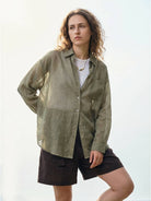 Lightweight 100% linen sheer overshirt with relaxed fit and button front