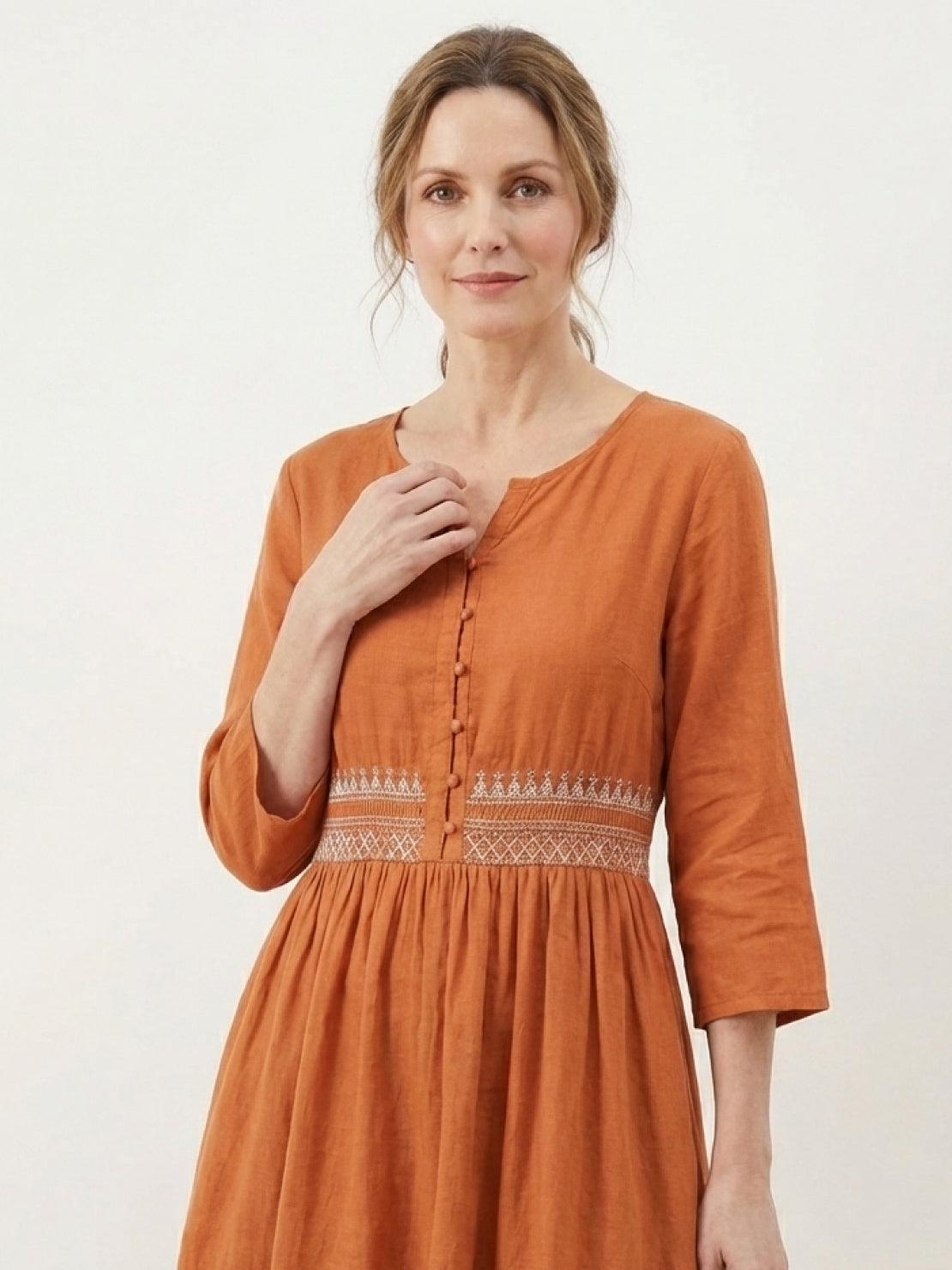 Rusty orange 100% cotton linen dress with smocked waist and folk-art embroidery
