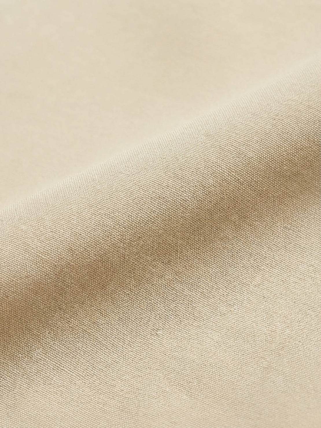 Maxi-length wrinkle-free button-down dress with point collar, chest pockets, long roll-up sleeves, side slits, and relaxed straight silhouette